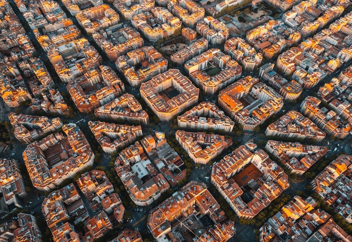 Aerial view of Barcelona's Eixample district showing its distinctive grid layout with octagonal blocks