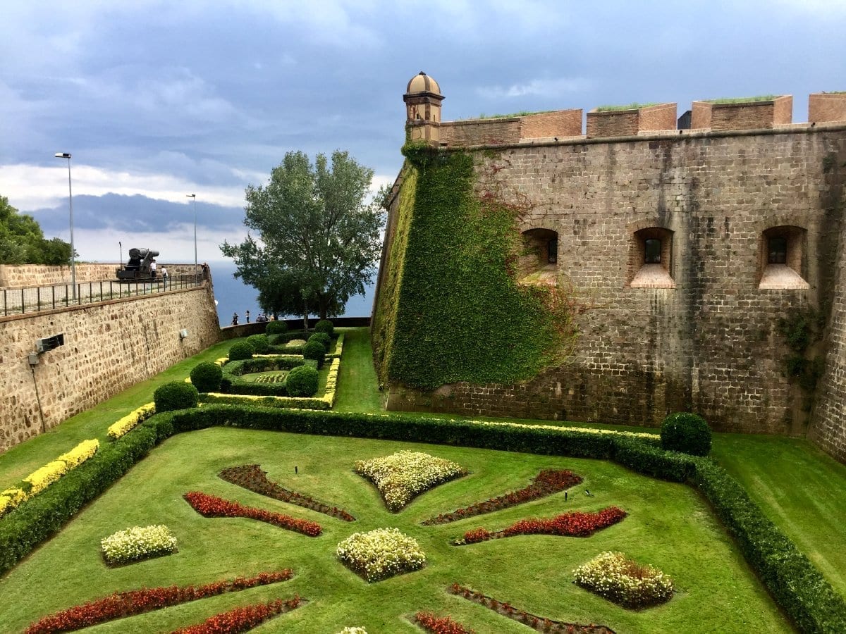 Gardens and stone walls at Castell de Montjuïc overlooking Barcelona