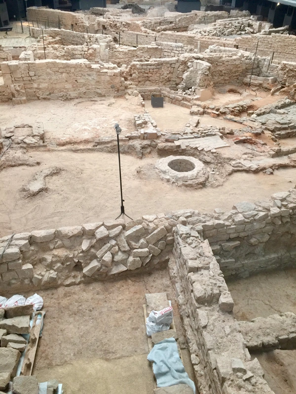 Preserved walls from the 18th century displayed under a covered walkway