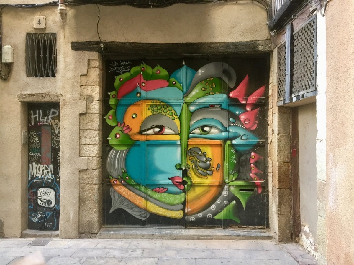 Colourful mural painted on a metal shop shutter